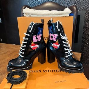 Special Louis Vuitton patent leather mid-calf boots.